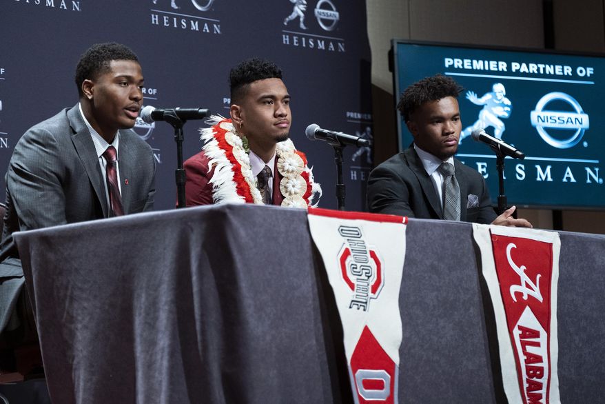 Heisman Trophy finalists, from left, Dwayne Haskins, from Ohio State; Tua Tagovailoa, from Alabama; and Kyler Murray, from Oklahoma, answer questions during a media event Saturday, Dec. 8, 2018, in New York. (AP Photo/Craig Ruttle)