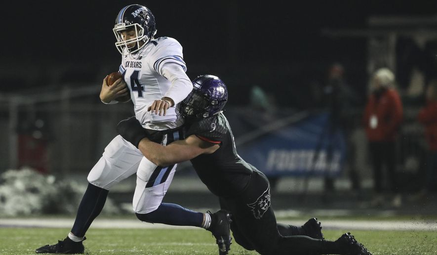 Maine quarterback Chris Ferguson (14) is sacked by Weber State's Adam Rodriguez (9) during the second half in a quarterfinal of the NCAA Football Championship Subdivision playoffs Friday, Dec. 7, 2018, in Ogden, Utah. (Matt Herp/Standard-Examiner via AP)