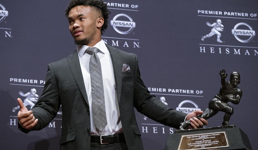 Oklahoma quarterback Kyler Murray holds the Hesiman Trophy after winning the award Saturday, Dec. 8, 2018, in New York. (AP Photo/Craig Ruttle)