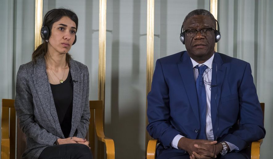 Nobel peace price laureates Nadia Murad, left, and Dr. Denis Mukwege look on during the press conference at the Nobelinstituttet in Oslo, Sunday Dec. 9, 2018. (Heiko Junge/NTB scanpix via AP)