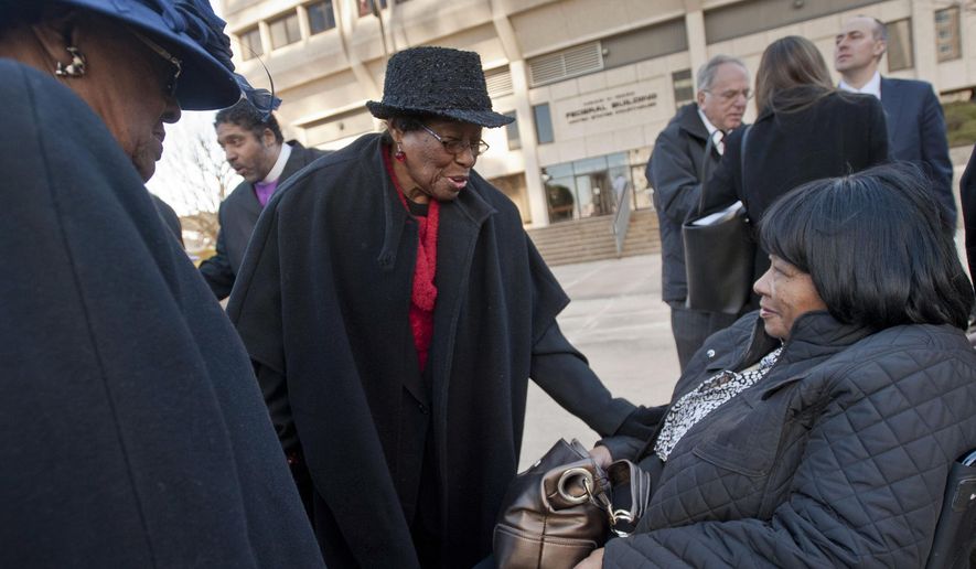 FILE - In this Dec. 12, 2013, file photo, Mary Perry, of Wendell, from left, Rosanell Eaton, of Franklin County, and Carolyn Coleman, of Greensboro, talk after a hearing at the Ward Federal Building in Winston-Salem, N.C., challenging the new North Carolina voting law. African-American North Carolina voting rights activist Eaton has died at age 97. Eaton's daughter, Armenta Eaton, says her mother died Saturday, Dec. 8, 2018, at home in Louisburg, North Carolina (Walt Unks/The Winston-Salem Journal via AP)