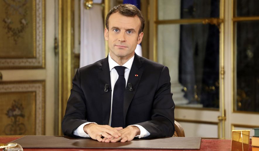 French President Emmanuel Macron poses before a special address to the nation, his first public comments after four weeks of nationwide &#x27;yellow vest&#x27; protests, at the Elysee Palace, in Paris, Monday, Dec. 10, 2018. Facing exceptional protests, French President Emmanuel Macron is promising to speed up tax relief for struggling workers and to scrap a tax hike for retirees. (Ludovic Marin/Pool Photo via AP)