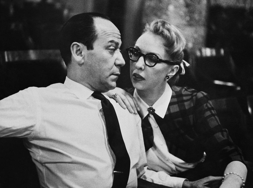 Broadway composer Frank Loesser and his wife and musical partner Lynn are shown, April 26, 1956 in New York. Their song "Baby, It's Cold Outside" was originally a song they performed for friends at their housewarming party. (AP Photo/Anthony Camerano)