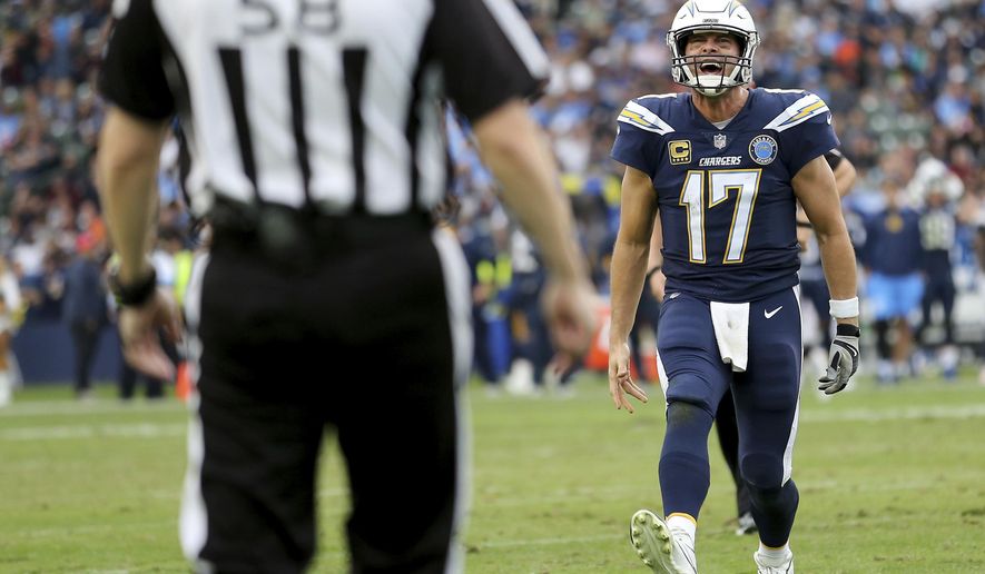Los Angeles Chargers quarterback Philip Rivers (17) argues with an official in the fourth quarter of an NFL football game against the Cincinnati Bengals, Sunday, Dec. 9, 2018, in Carson, Calif. (Kareem Elgazzar/The Cincinnati Enquirer via AP)