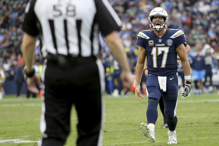 Los Angeles Chargers quarterback Philip Rivers (17) argues with an official in the fourth quarter of an NFL football game against the Cincinnati Bengals, Sunday, Dec. 9, 2018, in Carson, Calif. (Kareem Elgazzar/The Cincinnati Enquirer via AP)