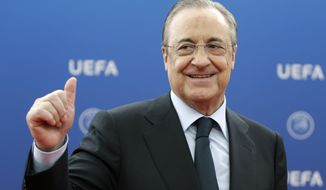 FILE - In this file photo dated Thursday, Aug. 30, 2018, Real Madrid President Florentino Perez gives a thumbs up as he arrives for the UEFA Champions League draw at the Grimaldi Forum, in Monaco. In a speech during Real Madrid’s most recent general assembly, president Florentino Perez answered questions from club members, and when asked about plans to create a women’s team, Perez didn’t answer. (AP Photo/Claude Paris, FILE)