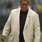 FILE - In this Dec. 9, 2018, file photo, Oakland Raiders general manager Reggie McKenzie stands on the field before an NFL football game between the Raiders and the Pittsburgh Steelers in Oakland, Calif. The Oakland Raiders have fired general manager Reggie McKenzie less than two years after he was named the NFL&#39;s executive of the year. A person familiar with the move says McKenzie was let go on Monday, Dec. 10, 2018, from the position he had held for almost seven seasons. The person spoke on condition of anonymity because the team has not made an announcement. (AP Photo/Ben Margot, File)