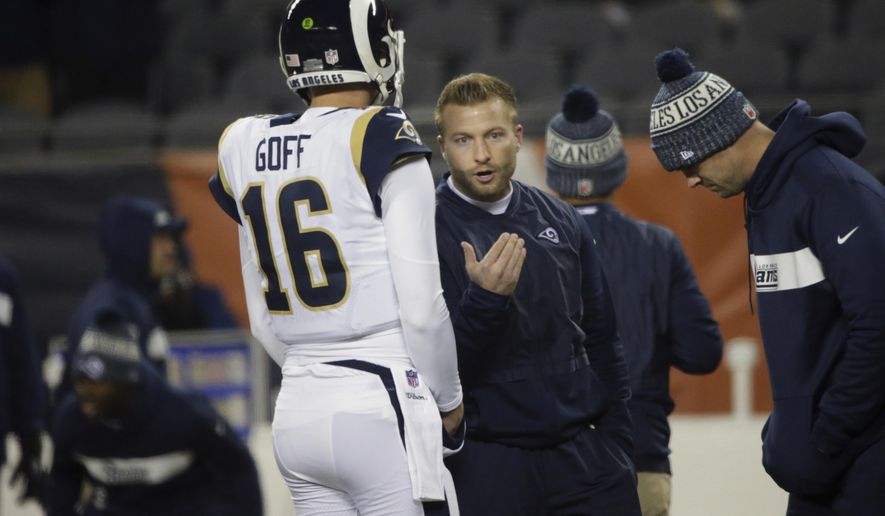 Los Angeles Rams head coach Sean McVay talks to Los quarterback Jared Goff (16) before an NFL football game against the Chicago Bears Sunday, Dec. 9, 2018, in Chicago. (AP Photo/David Banks)