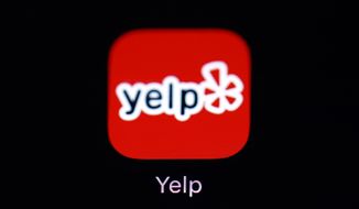 FILE - This March 19, 2018, file photo shows the Yelp app on an iPad in Baltimore. A large shareholder at Yelp says it’s lost patience with the review site and wants to see the company board reshuffled. In a letter released publicly Monday, Dec. 10, SQN Investors LP said that it wants Yelp Inc. to add some new directors to its board, including shareholder representatives. (AP Photo/Patrick Semansky, File)
