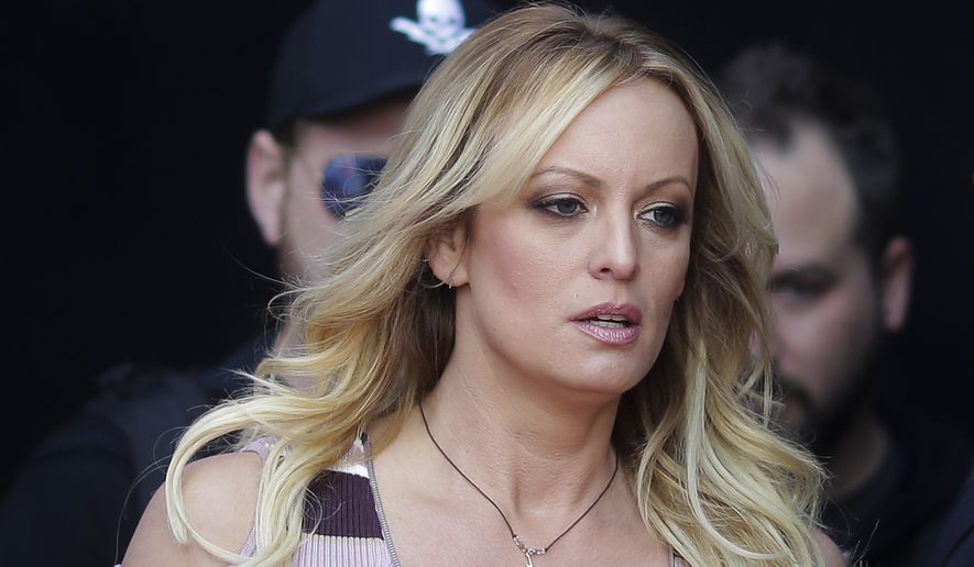 In this Oct. 11, 2018, file photo, adult film actress Stormy Daniels arrives for the opening of the adult entertainment fair &quot;Venus,&quot; in Berlin. (AP Photo/Markus Schreiber, File)