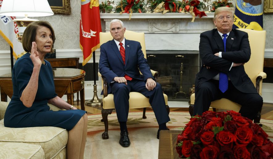 Vice President Mike Pence, center, listens as President Donald Trump argues with House Minority Leader Rep. Nancy Pelosi, D-Calif., during a meeting in the Oval Office of the White House, Tuesday, Dec. 11, 2018, in Washington. (AP Photo/Evan Vucci)