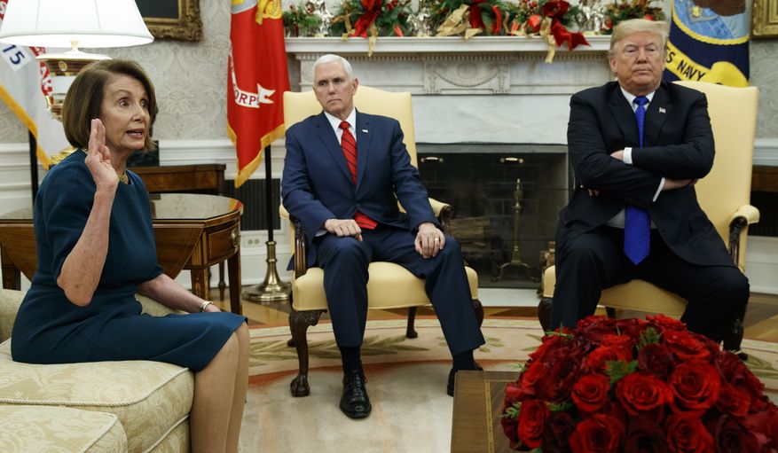 Vice President Mike Pence, center, listens as President Donald Trump argues with House Minority Leader Rep. Nancy Pelosi, D-Calif., during a meeting in the Oval Office of the White House, Tuesday, Dec. 11, 2018, in Washington. (AP Photo/Evan Vucci)