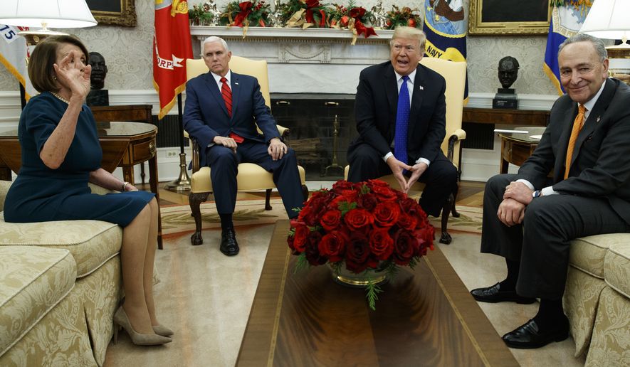 House Minority Leader Rep. Nancy Pelosi, D-Calif., Vice President Mike Pence, President Donald Trump, and Senate Minority Leader Chuck Schumer, D-N.Y., argue during a meeting in the Oval Office of the White House, Tuesday, Dec. 11, 2018, in Washington. (AP Photo/Evan Vucci)