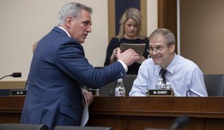 House Majority Leader Kevin McCarthy, R-Calif., left, talks with Rep. Jim Jordan, R-Ohio, before the House Judiciary Committee questions Google CEO Sundar Pichai about the internet giant&#39;s privacy security and data collection, on Capitol Hill in Washington, Tuesday, Dec. 11, 2018. McCarthy made an opening statement before Pichai appeared. (AP Photo/J. Scott Applewhite)