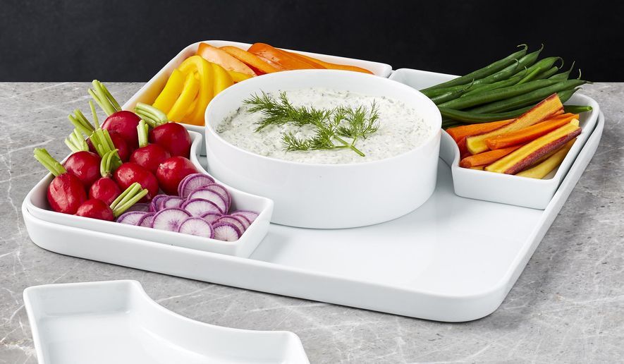 This photo provided by Crate & Barrel shows a modular serving set. An item like this available at Crate & Barrel can lend a hand in entertaining in a small space. With a little planning, even the smallest homes can be just right for holiday entertaining. (Crate & Barrel via AP)