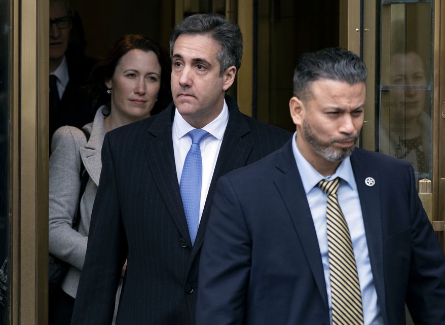 Michael Cohen, President Donald Trump&#39;s former lawyer, leaves federal court after his sentencing in New York, Wednesday, Dec. 12, 2018. Cohen was sentenced Wednesday to three years in prison for an array of crimes that included arranging the payment of hush money to two women that he says was done at the direction of Trump. (AP Photo/Craig Ruttle)