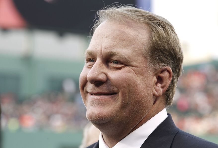 Former Boston Red Sox pitcher Curt Schilling looks on after being introduced as a new member of the Boston Red Sox Hall of Fame before the baseball game between the Boston Red Sox and the Minnesota Twins at Fenway Park in Boston Friday, Aug. 3, 2012. (AP Photo/Winslow Townson)
