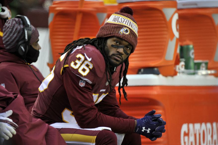 FILE - In this Sunday, Dec. 9, 2018 file photo, Washington Redskins free safety D.J. Swearinger sits on the bench in the fourth quarter of an NFL football game against the New York Giants in Landover, Md. The Washington Redskins have lost four in a row, are down to their fourth quarterback and are mired in criticism from several players. A once-promising season has gone off the rails thanks to injuries all over the offense and a defense full of blown assignments and missed tackles. The finger-pointing is well underway for a team that has fallen to 6-7 and has plenty of blame to go around. (AP Photo/Mark Tenally, File)