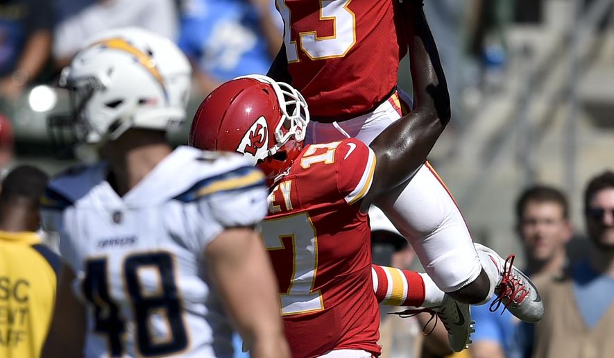 FILE - In this Sunday, Sept. 9, 2018, file photo, Kansas City Chiefs wide receiver De'Anthony Thomas celebrates after scoring with wide receiver Chris Conley during the second half of an NFL football game against the Los Angeles Chargers in Carson, Calif. The Kansas City Chiefs are missing their star running back, likely without his backup and could have their top two wide receivers hobbled or shelved for their crucial AFC West showdown against the Los Angeles Chargers on Thursday, Dec. 13. (AP Photo/Kelvin Kuo, File)