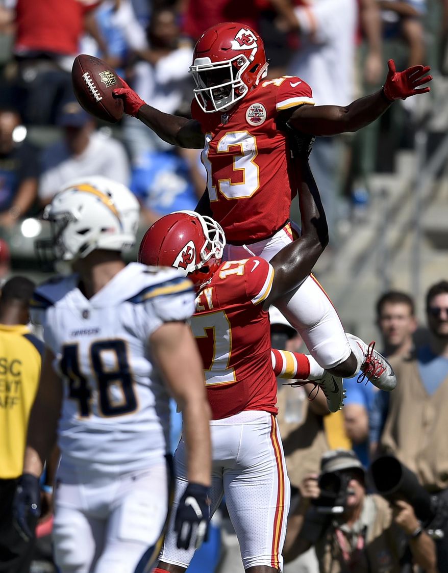 FILE - In this Sunday, Sept. 9, 2018, file photo, Kansas City Chiefs wide receiver De'Anthony Thomas celebrates after scoring with wide receiver Chris Conley during the second half of an NFL football game against the Los Angeles Chargers in Carson, Calif. The Kansas City Chiefs are missing their star running back, likely without his backup and could have their top two wide receivers hobbled or shelved for their crucial AFC West showdown against the Los Angeles Chargers on Thursday, Dec. 13. (AP Photo/Kelvin Kuo, File)