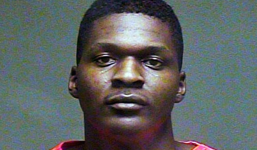 This February 2016 file booking photo provided by the Oklahoma County Sheriff's Office shows Quinton Laster. Jurors on Tuesday, Dec. 11, 2018, rejected a mental incompetence claim from Laster, who is accused of shooting then decapitating his grandmother and her husband at an in-home daycare in Oklahoma City in 2016. The ruling will allow the case to move forward. (Oklahoma County Sheriff's Office via AP, File)