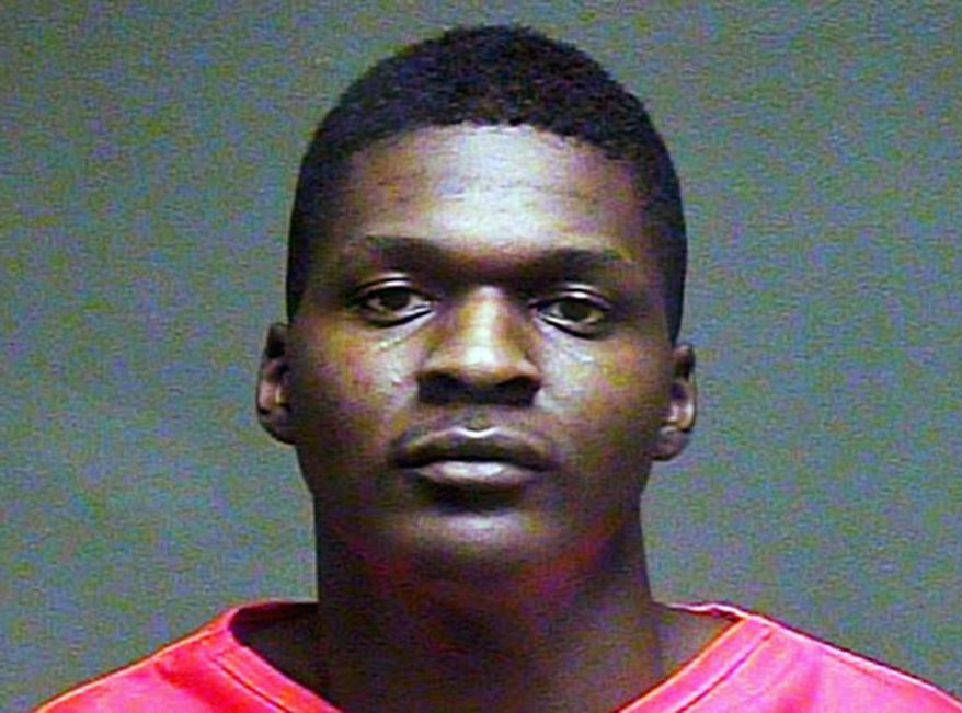 This February 2016 file booking photo provided by the Oklahoma County Sheriff's Office shows Quinton Laster. Jurors on Tuesday, Dec. 11, 2018, rejected a mental incompetence claim from Laster, who is accused of shooting then decapitating his grandmother and her husband at an in-home daycare in Oklahoma City in 2016. The ruling will allow the case to move forward. (Oklahoma County Sheriff's Office via AP, File)