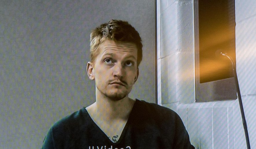 In this Wednesday, Dec. 5, 2018 photo, Jared Chance appears on a monitor during a video arraignment at the Kent County Courthouse in Grand Rapids, Mich. Chance has been charged in the dismemberment of a woman in his apartment in western Michigan. (Cory Morse/The Grand Rapids Press via AP)