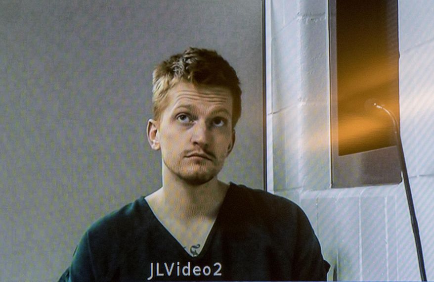In this Wednesday, Dec. 5, 2018 photo, Jared Chance appears on a monitor during a video arraignment at the Kent County Courthouse in Grand Rapids, Mich. Chance has been charged in the dismemberment of a woman in his apartment in western Michigan. (Cory Morse/The Grand Rapids Press via AP)