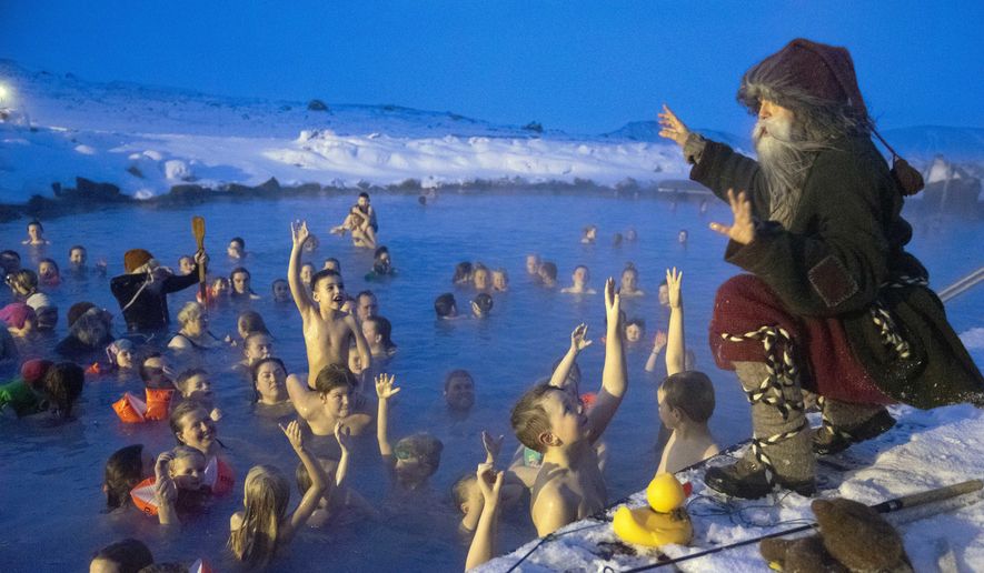 Local actor playing &#39;Candel-Stealer&#39;, one of Iceland&#39;s 13 mischievous troll brothers that have taken the role of Father Christmas, addresses guests at the geothermal nature lagoon by Lake Myvatn, north Iceland, Saturday Dec. 8, 2018. Instead of a friendly Santa Claus, children in Iceland enjoy favors from 13 mischievous troll brothers that arrive from the mountains thirteen days before Christmas. (AP Photo/Egill Bjarnason)