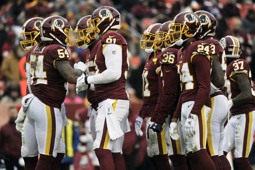 FILE - In this Sunday, Dec. 9, 2018 file photo, Washington Redskins defense huddles during an NFL football game against the New York Giants in Landover, Md. The Washington Redskins have lost four in a row, are down to their fourth quarterback and are mired in criticism from several players. A once-promising season has gone off the rails thanks to injuries all over the offense and a defense full of blown assignments and missed tackles. The finger-pointing is well underway for a team that has fallen to 6-7 and has plenty of blame to go around. (AP Photo/Mark Tenally, File)