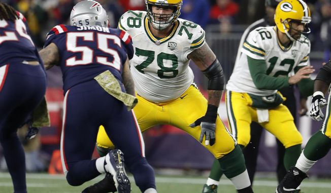 FILE - In this Sunday, Nov. 4, 2018  file photo, Green Bay Packers offensive tackle Jason Spriggs during an NFL football game against the New England Patriots at Gillette Stadium in Foxborough, Mass. Protecting quarterback Aaron Rodgers will be of the utmost importance for the Green Bay Packers when they face the Chicago Bears and their NFC-best defense on Sunday. The offensive line will be tested by a Bears defense that tripped up the high-octane Los Angeles Rams last week. The protection did hold up last week in the second half of a win over the Falcons last week, with backups playing at both guard spots and right tackle. (Winslow Townson/AP Images for Panini, File)