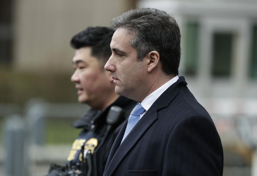 Michael Cohen, President Donald Trump's former lawyer, leaves federal court after his sentencing in New York, Wednesday, Dec. 12, 2018. Cohen was sentenced Wednesday to three years in prison for an array of crimes that included arranging the payment of hush money to two women that he says was done at the direction of Trump. (AP Photo/Julio Cortez)