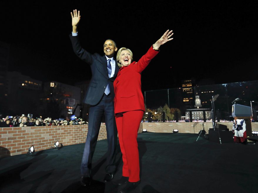President Barack Obama waves on stage with Democratic presidential candidate Hillary Clinton during a rally at Independence Hall in Philadelphia, Monday, Nov. 7, 2016. (AP Photo/Pablo Martinez Monsivais)
