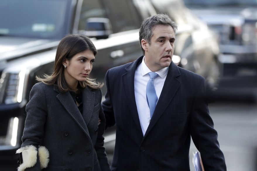 Michael Cohen, right, President Donald Trump&#39;s former lawyer, arrives at federal court with his daughter, Samantha Cohen, for his sentencing for dodging taxes, lying to Congress and violating campaign finance laws in New York on Wednesday, Dec. 12, 2018. (AP Photo/Julio Cortez)