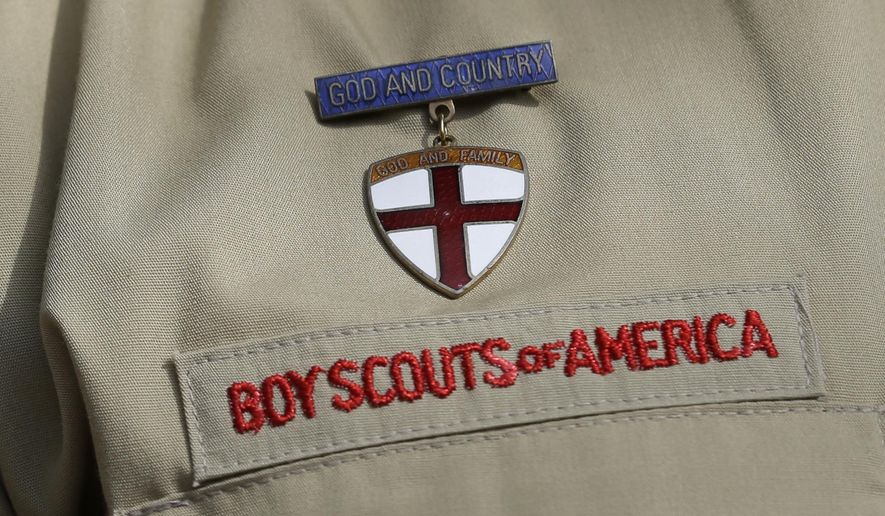 FILE - In this Feb. 4, 2013 file photo, shows a close up detail of a Boy Scout uniform worn during a news conference in front of the Boy Scouts of America headquarters in Irving, Texas.  The Boy Scouts of America says it is exploring &amp;quot;all options&amp;quot; to address serious financial challenges, but is declining to confirm or deny a report that it may seek bankruptcy protection in the face of declining membership and sex-abuse litigation.  &amp;quot;I want to assure you that our daily mission will continue and that there are no imminent actions or immediate decisions expected,&amp;quot; Chief Scout Executive Mike Surbaugh said in a statement issued Wednesday, Dec. 12, 2018.    (AP Photo/Tony Gutierrez, File)