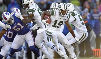 FILE - In this Sunday, Dec. 9, 2018, file photo, New York Jets&#39; Andre Roberts (19) runs with the ball during the first half of an NFL football game against the Buffalo Bills in Orchard Park, N.Y. Roberts is a travelin&#39; man who enjoys hitting the road. You name a destination and there&#39;s a good chance the Jets kick returner has been there. After all, Roberts has visited all seven continents. (AP Photo/Adrian Kraus, File)