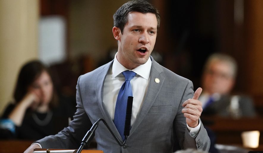 FILE - In this March 28, 2018, file photo, Sen. Adam Morfeld speaks at the Legislature in Lincoln, Neb. Nebraska voters may get the chance decide a medical marijuana ballot measure in 2020 if lawmakers don't approve one in the session that starts next month. State Sens. Anna Wishart and Morfeld, both of Lincoln, announced the formation Thursday, Dec. 13, 2018, of Nebraskans for Sensible Marijuana Laws, a committee primed to launch a signature-gathering campaign. (AP Photo/Nati Harnik, File)
