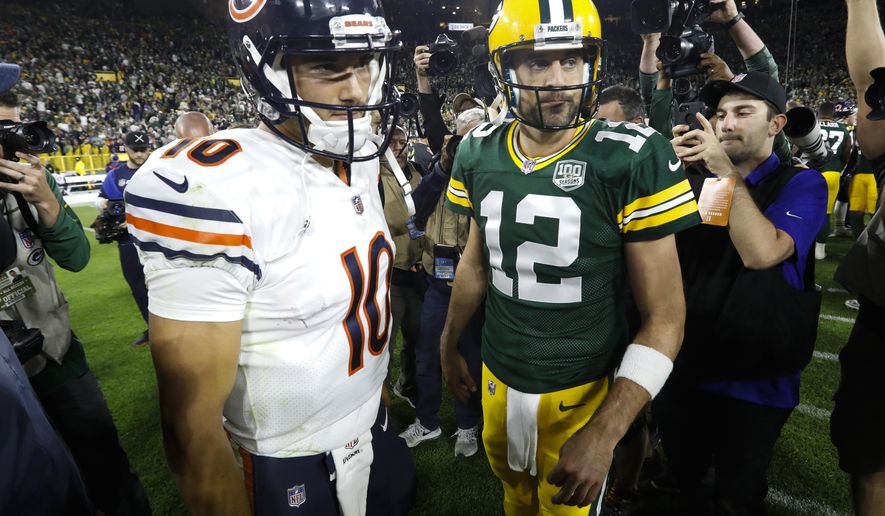 FILE - In this Sept. 9, 2018, file photo, Chicago Bears' Mitchell Trubisky, left, talks to Green Bay Packers' Aaron Rodgers after the Packers defeated the Bears 24-23 in an NFL football game in Green Bay, Wis. Clinch the NFC North championship and beat a division rival to do it? The Chicago Bears couldn’t have asked for a sweeter scenario. That’s exactly the opportunity they’re staring at when they host Aaron Rodgers and the fading Green Bay Packers on Sunday afternoon. (AP Photo/Mike Roemer, File)