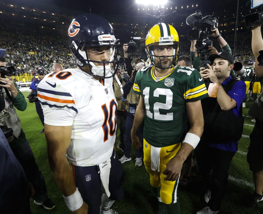 FILE - In this Sept. 9, 2018, file photo, Chicago Bears' Mitchell Trubisky, left, talks to Green Bay Packers' Aaron Rodgers after the Packers defeated the Bears 24-23 in an NFL football game in Green Bay, Wis. Clinch the NFC North championship and beat a division rival to do it? The Chicago Bears couldn’t have asked for a sweeter scenario. That’s exactly the opportunity they’re staring at when they host Aaron Rodgers and the fading Green Bay Packers on Sunday afternoon. (AP Photo/Mike Roemer, File)