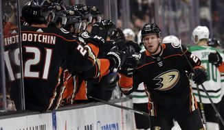 Anaheim Ducks&#39; Ondrej Kase, right, celebrates his goal with teammates during the first period of an NHL hockey game against the Dallas Stars, Wednesday, Dec. 12, 2018, in Anaheim, Calif. (AP Photo/Marcio Jose Sanchez)