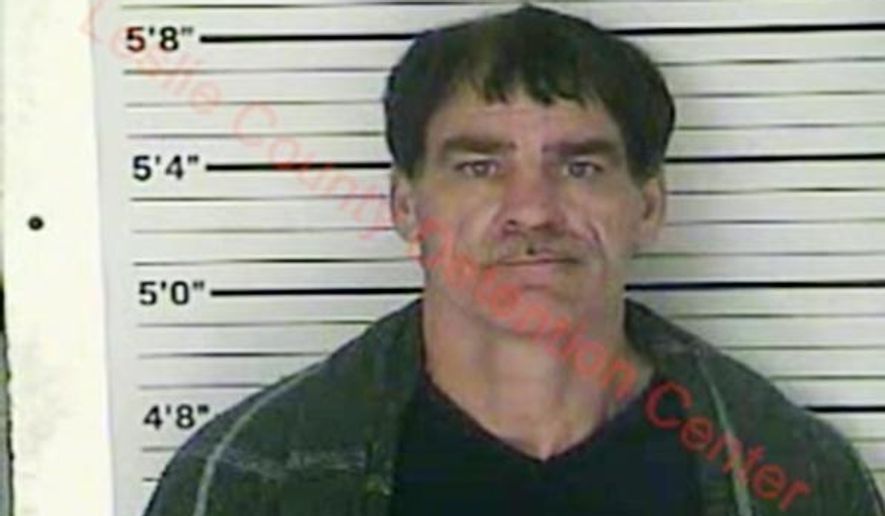In this Wednesday, Dec. 12, 2018 photo released by the Leslie County (Ky.) Detention Center, Paul Douglas Sizemore is seen in a booking photo. Sizemore, accused of shooting at a state police trooper rushing to the scene of a triple slaying has been charged in the murders of an eastern Kentucky couple and their adult son, police said Thursday. (Leslie County Detention Center via AP)