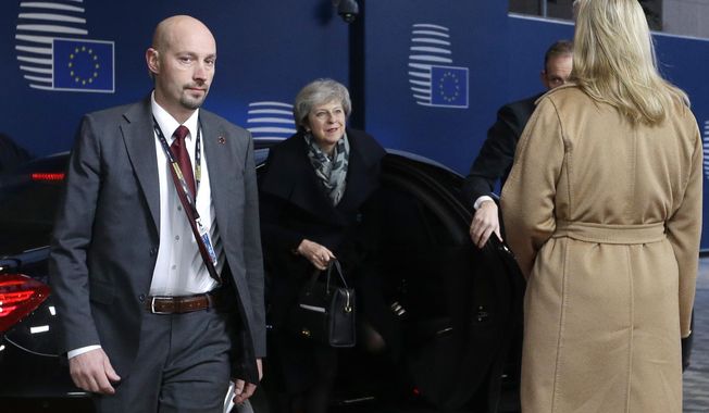 British Prime Minister Theresa May arrives for an EU summit in Brussels, Friday, Dec. 14, 2018. European Union leaders have offered Theresa May sympathy but no promises, as the British prime minister seeks a lifeline that could help her sell her Brexit divorce deal to a hostile U.K. Parliament. (AP Photo/Alastair Grant, Pool)