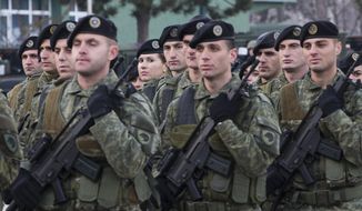 Members of Kosovo Security Force line up for inspection by Kosovo president Hashim Thaci in capital Pristina, Kosovo, on Thursday, Dec. 13, 2018.  Kosovo lawmakers are set to transform the Kosovo Security Force into a regular army. (AP Photo/Visar Kryeziu)