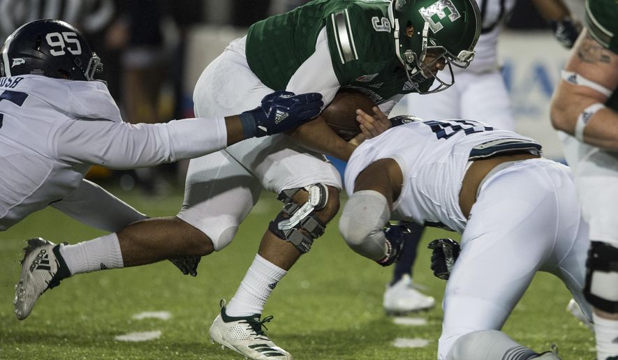 Eastern Michigan quarterback Mike Glass, III, (9) runs the ball against Georgia Southern during the Camellia Bowl NCAA college football game in Montgomery, Ala., on Saturday, Dec. 15, 2018. (Jake Crandall/The Montgomery Advertiser via AP)