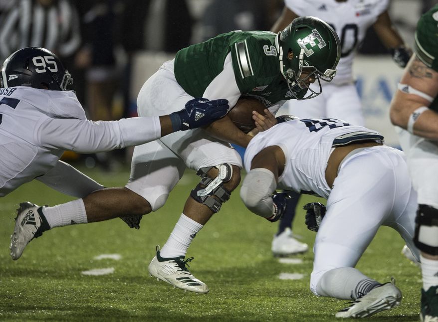 Eastern Michigan quarterback Mike Glass, III, (9) runs the ball against Georgia Southern during the Camellia Bowl NCAA college football game in Montgomery, Ala., on Saturday, Dec. 15, 2018. (Jake Crandall/The Montgomery Advertiser via AP)