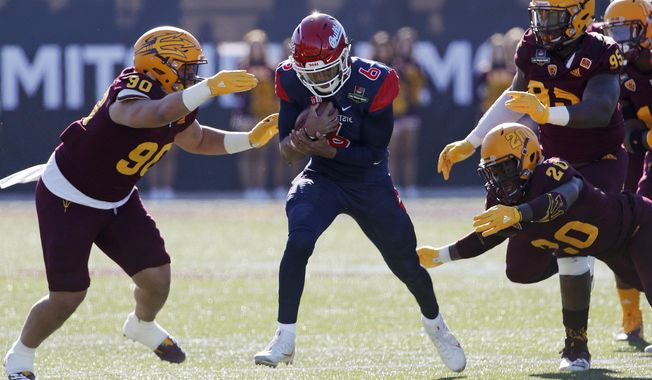 Fresno State quarterback Marcus McMaryion (6) runs for a gain against Arizona State during the first half of the Las Vegas Bowl NCAA college football game, Saturday, Dec. 15, 2018, in Las Vegas. (AP Photo/John Locher)