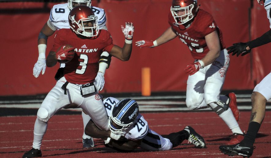 Eastern Washington quarterback Eric Barriere (3) runs the ball against Maine defensive back Shaquille St-Lot (28) during the second half of an NCAA college football game Saturday, Dec. 15, 2018, at Roos Field in Cheney, Wash. (Kathy Plonka/The Spokesman-Review via AP)