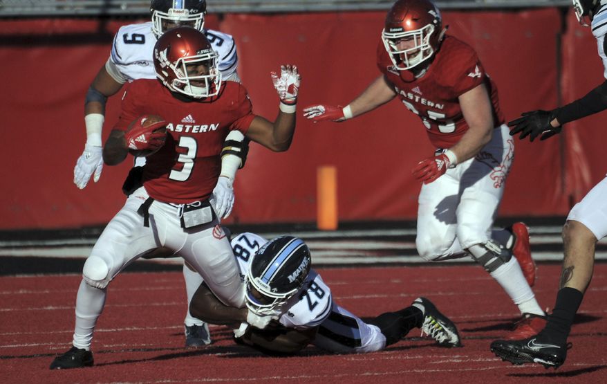 Eastern Washington quarterback Eric Barriere (3) runs the ball against Maine defensive back Shaquille St-Lot (28) during the second half of an NCAA college football game Saturday, Dec. 15, 2018, at Roos Field in Cheney, Wash. (Kathy Plonka/The Spokesman-Review via AP)