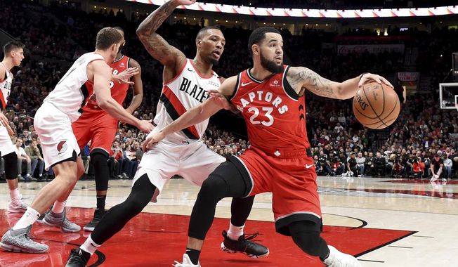 Toronto Raptors guard Fred VanVleet, right, tries to get past Portland Trail Blazers guard Damian Lillard, left, during the first half of an NBA basketball game in Portland, Ore., Friday, Dec. 14, 2018. (AP Photo/Steve Dykes)