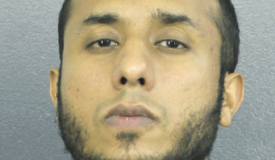 This Dec. 14, 2018 photo made available by the Broward County Sheriff's Office, Fla., shows Tayyab Tahir Ismail under arrest. An FBI affidavit unsealed Monday, Dec. 17, 2018, charges Ismail with posting detailed bomb-making instructions to online sites frequented by extremists such as supporters of the Islamic State group. (Broward County Sheriff's Office via AP)